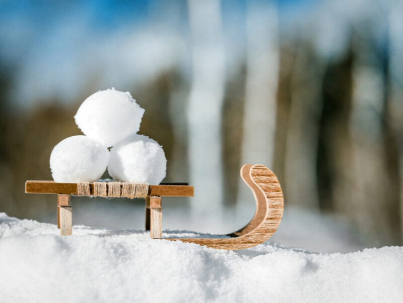 Three snowballs piled on a small sledge
