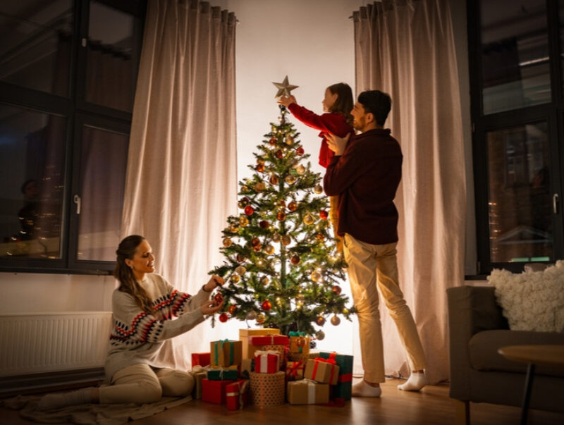 A family decorating their Christmas tree